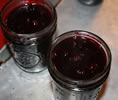 filled jelly jars with hot pack of blueberries